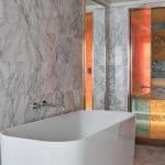 The Massive Suite bathroom featuring a full-size soaking bath tub.