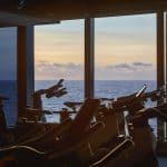 View of the ocean from B Complex Bike, the part of our gym dedicated to spin, as the sun sets.